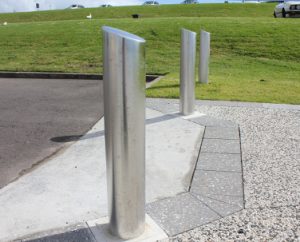 Outdoor bollard with angled top bollards