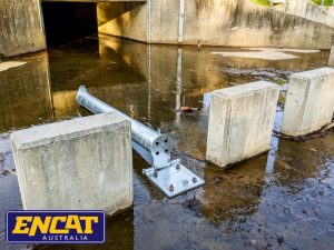 Collapsible bollard for culvert debris control ENCAT Collapsible Bollard for Culvert Debris Control Structures laying flat