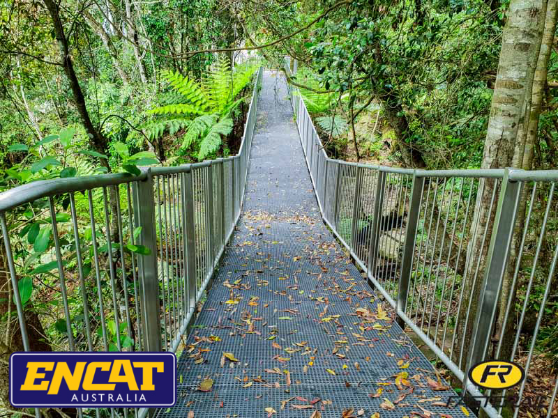 Custom walkway platform with ball stanchion handrail for a water reservoir Steel mesh walkway with infill balustrade through rainforest at Minnamurra Rainforest, Budderoo National Park NSW